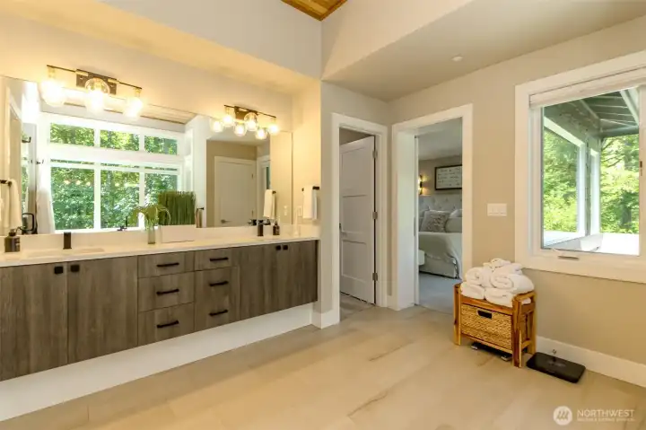 Double sinks in the soap like primary bathroom.