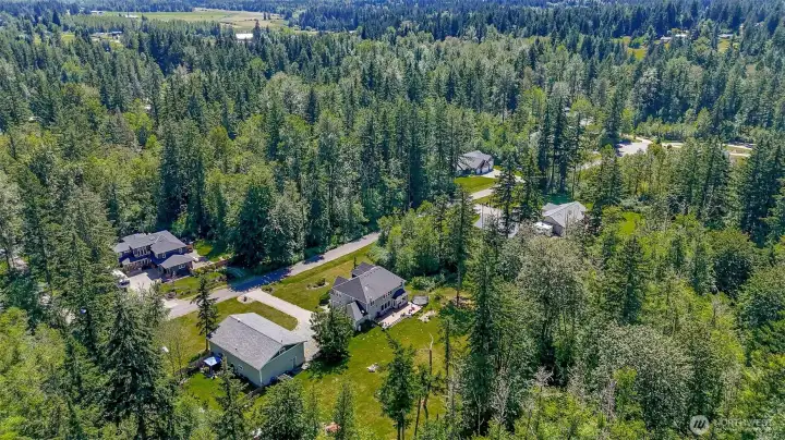 The community has all estate style homes on approximately five acres, the subject home is picture in the left side of this photo.