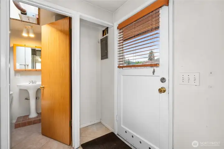 Three-Quarter Bath with Access to Utility Room and Backyard
