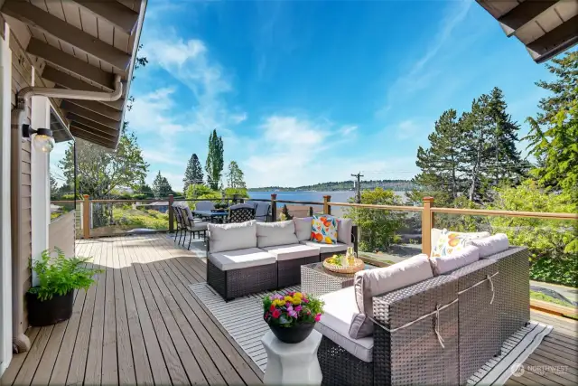 3,130 square foot home carefully crafted in 1975 with period architectural details including open beam cathedral ceilings, light-filled spaces with walls of windows and huge view decks and patios perfect for large summer BBQ’s.