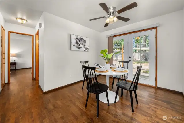 dining room splits the kitchen from the living rm and hallway leading to bedrooms & Full bath