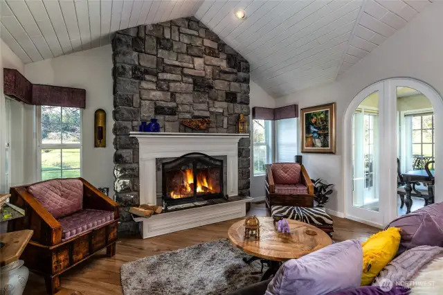 Wood burning stone fireplace making the livng room a cozy place to relax.