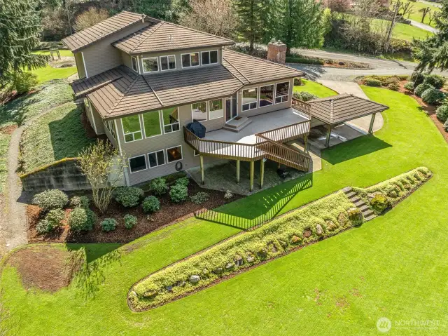 Aerial back of home. Exterior whole house security lighting.