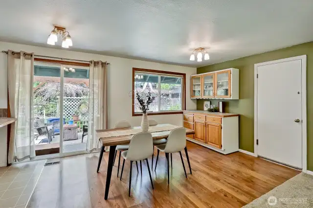 Spacious dining area leading to covered back porch.