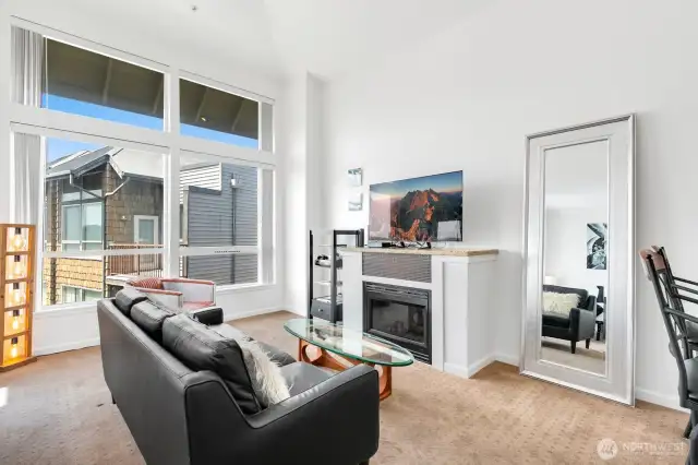 Vaulted ceilings and a wall of windows make this unit feel spacious.