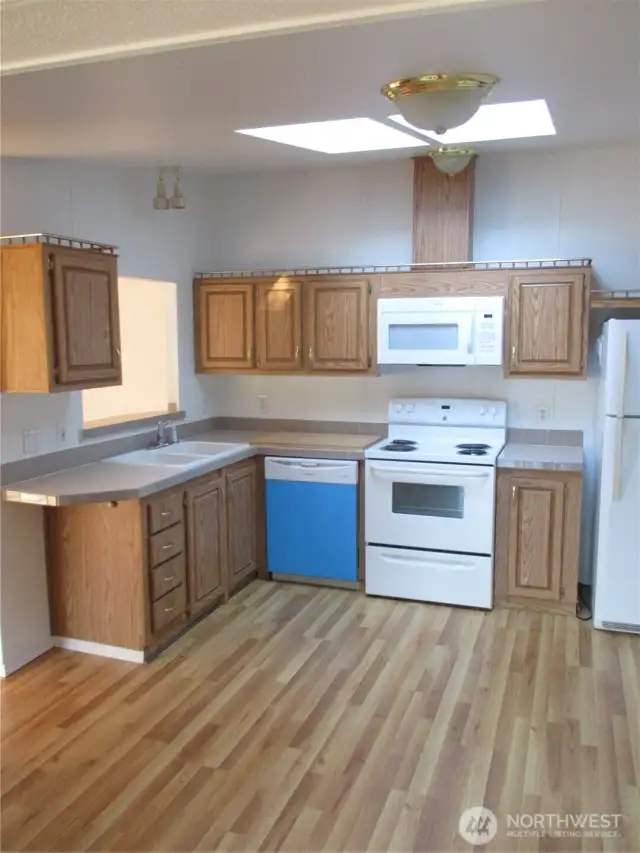 Roomy kitchen.  New sink, dishwasher and microwave,