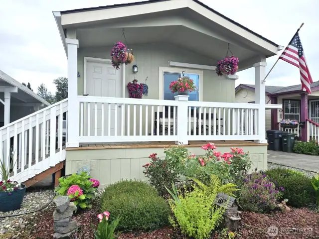Enjoy the lovely garden in front. The roses are gorgeous in full bloom.