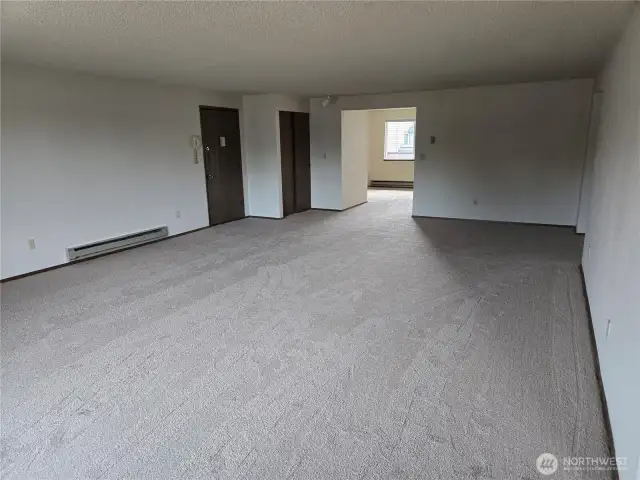 Standing near kitchen.