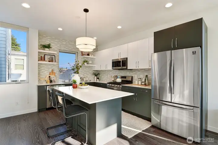 Chef's kitchen includes large island, great for cooking and entertaining.