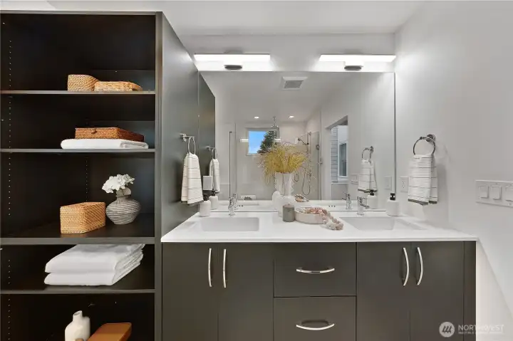 Primary bathroom has a double vanity, lots of storage and heated floors.