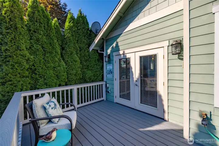 French doors lead from the dining room to the deck and private yard.