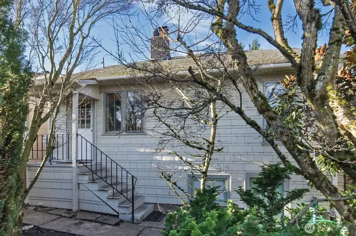 Rear of house. The stairs lead to the entry into the kitchen.