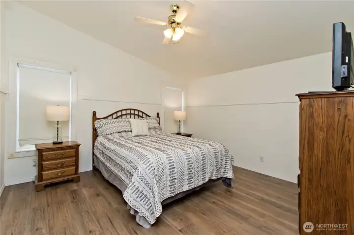 Primary bedroom with vaulted ceilings and walk in closet