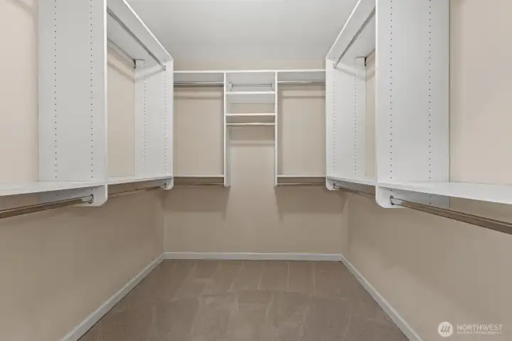 Primary walk-in-closet with plenty of hanging space.