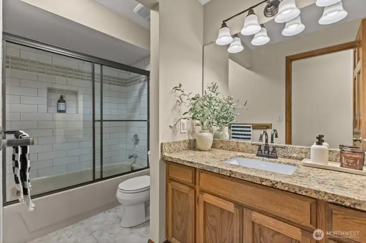 Full-size hall bath is roomy and has great light!
