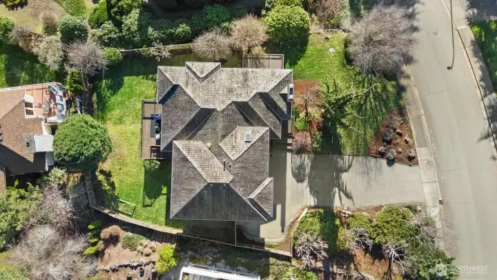 Aerial view of the home and the beautiful lot it sits on.