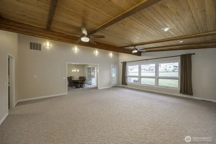 Huge family room with the Post Modern beautiful wood ceilings and a view to the large backyard.