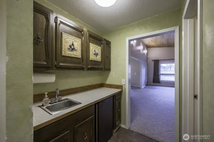 Wet Bar with a handy fridge! A 1/2 bath all right off of the family room!