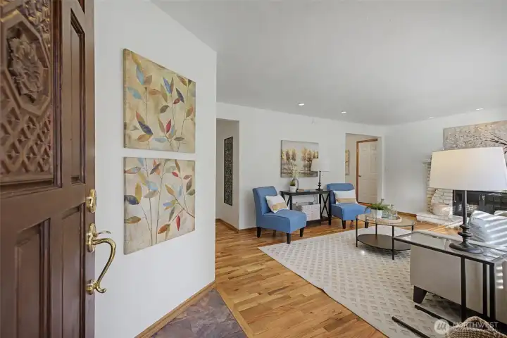 Inviting front entry opening to the living room with hardwood floors and an easy, welcoming flow.