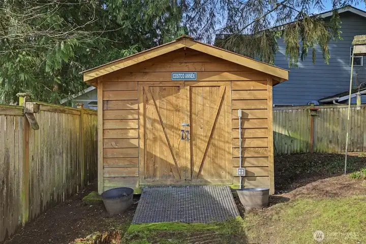 Backyard includes a 10×12 storage shed — plenty of room for bikes, tools, and garden equipment.