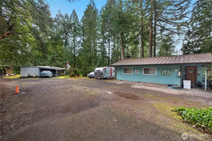 1.5 private treed acres on Young Cove with so much potential. Two homes (828 sq rambler & 902 sq ft mobile home). Live in one and build your dream home. Multigenerational living. Maintain as income property, or a combination.