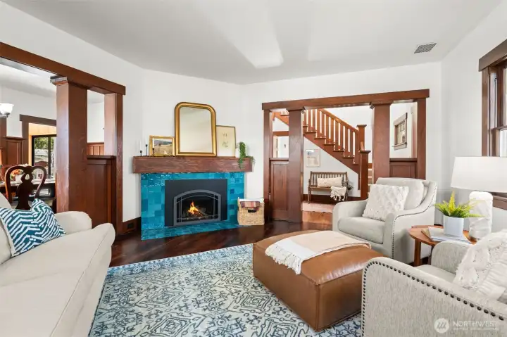 The homeowners have honored the home’s original character, preserved the millwork and thoughtfully added modern updates like this stunning fireplace with a warm gas insert.