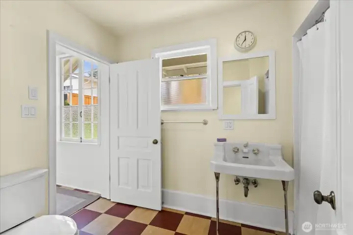 Full bath on main accessed through bedroom or the kitchen.