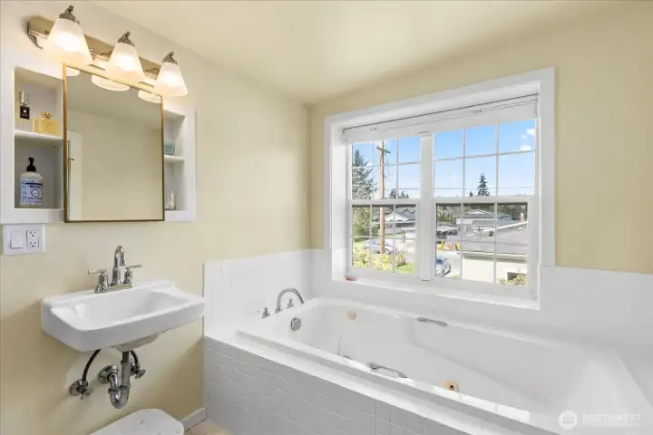 Primary bath with soaking tub and separate shower.