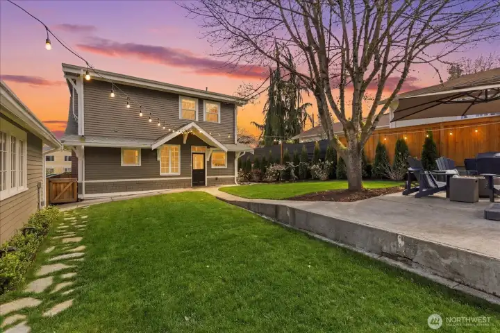 Walking path to the detached garage and patio.