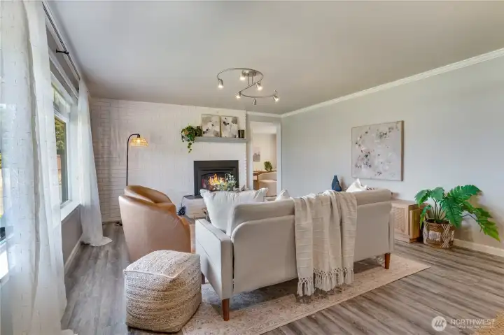 LVP flooring. Floor to ceiling windows. Newer gas fireplace. LVP flooring. Floor to ceiling windows. Newer gas fireplace.