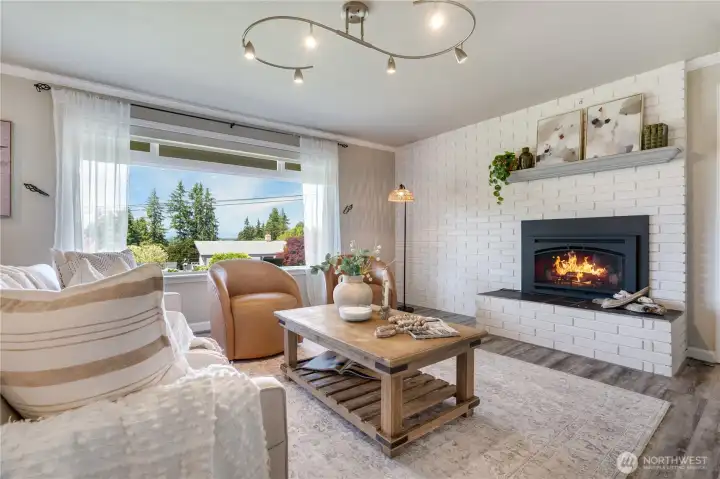 West facing. The sunsets here are wonderful. Partial views of the Olympic Mountain Range and gas fireplace for cooler months. West facing. The sunsets here are wonderful. Partial views of the Olympic Mountain Range and gas fireplace for cooler months.