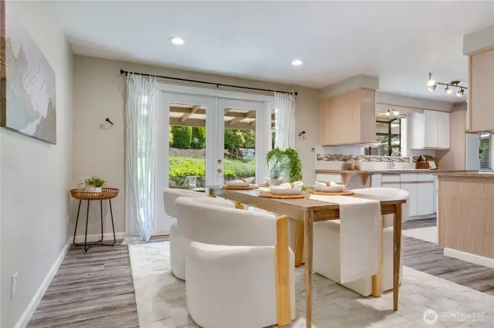 Forming dining room. French doors lead to your backyard! This house flows beautifully Forming dining room. French doors lead to your backyard! This house flows beautifully
