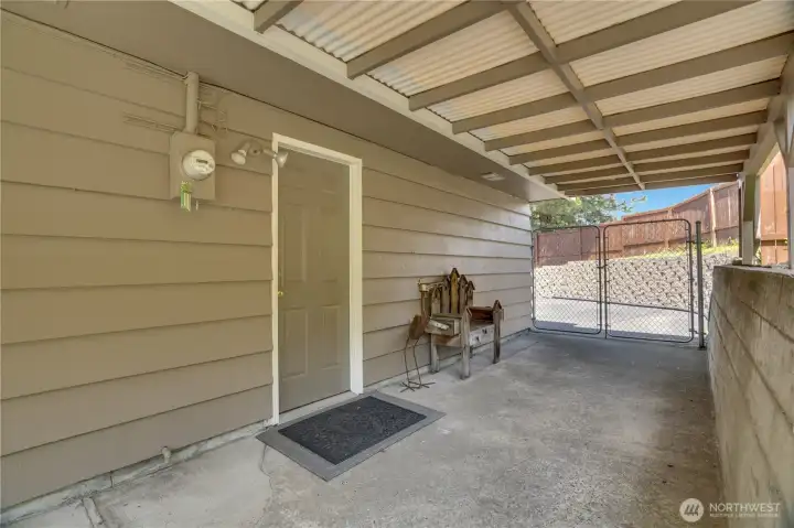 This door leads to the 2-car attached garage. This door leads to the 2-car attached garage.