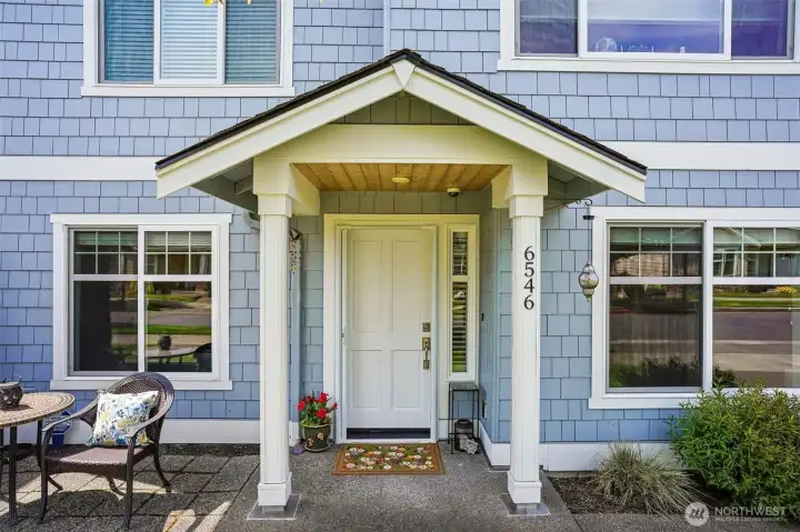 Covered front porch with retractable screen. Covered front porch with retractable screen.