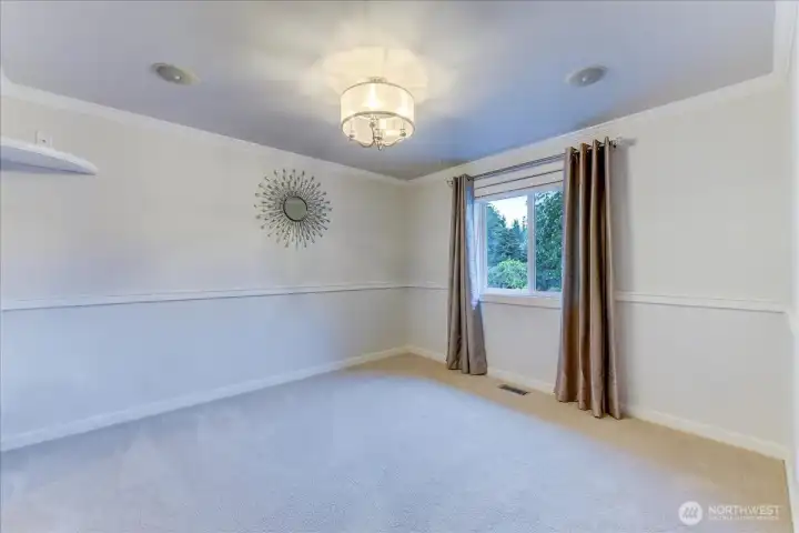 Third guest bedroom featuring a spacious walk-in closet.