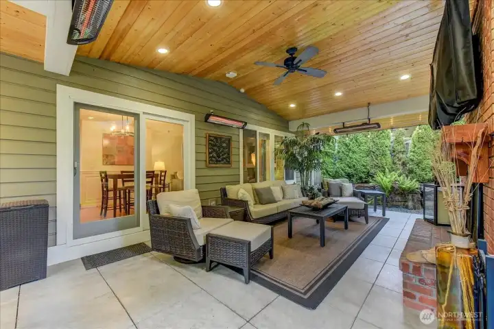 Spacious seating area featuring custom craftsmanship, a ceiling fan, and integrated Bose surround sound speakers.
