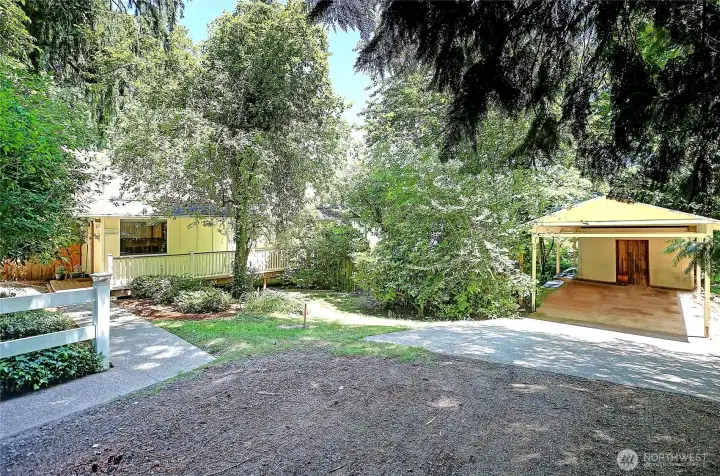 View of the front of the home with the detached carport.
