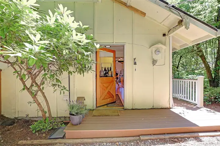 Nice covered porch which leads around to the back of the house.
