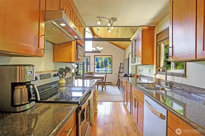 View of the kitchen leading into the dining and living room area.