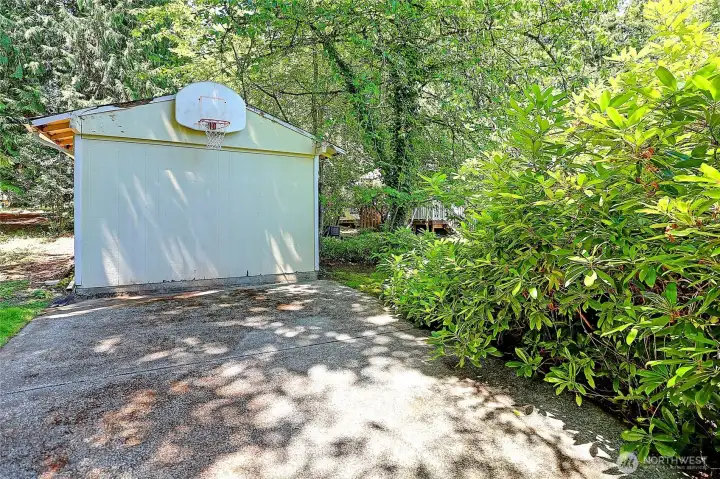 Enjoy a game of basketball in this shaded part of the property.