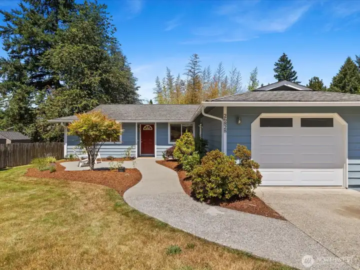 Notice the gracious sidewalk and patio. A very attractive entrance.