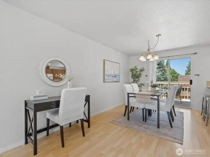 The holiday sized dining room opens to the deck for even more entertaining space.
