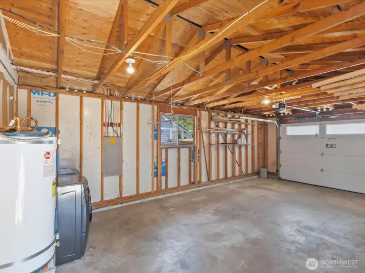 The garage includes a door opener and laundry space. The washer and dryer will stay with the house.
