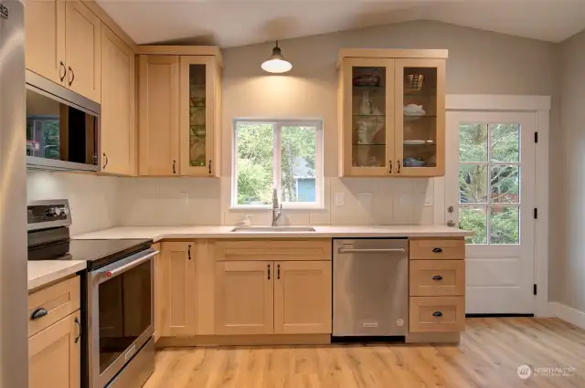 This open well-appointed kitchen looks to be well-sized for the home and has plenty of counter space.