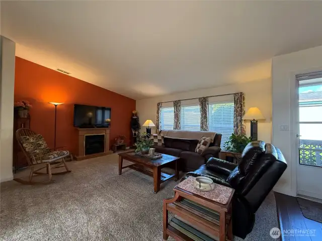 This home features a spacious living room with a propane fireplace that provides a nice focal point and a warm inviting space.