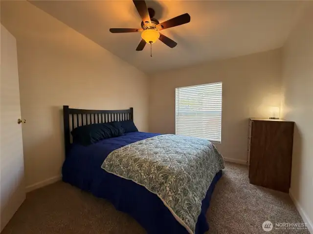 A large guest bedroom with a cute walk-in closet is perfect for when you have guests stay the weekend!