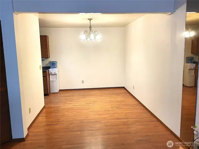 Dining room is next to a kitchen