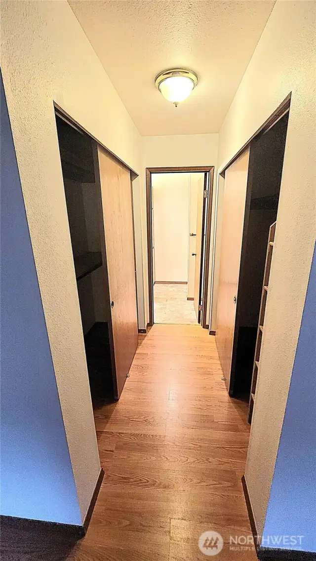 His and hers closet in primary bedroom