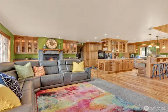 Another view of large family room with gas/propane fireplace, it has a blower to distribute the heat throughout the room.