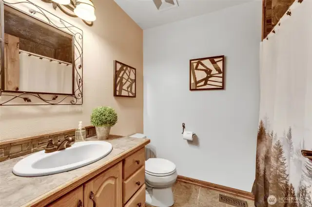 Main floor 3/4 bath, next to Bedroom #1.